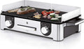Parrilla eléctrica WMF Lono Master Grill 2026, 50x28 cm, parrilla de mesa eléctrica con paravientos y bandeja recogegrasa, certificada para uso exterior, 2 superficies de cocción ajustables independientemente, 2400 W, acero inoxidable mate.