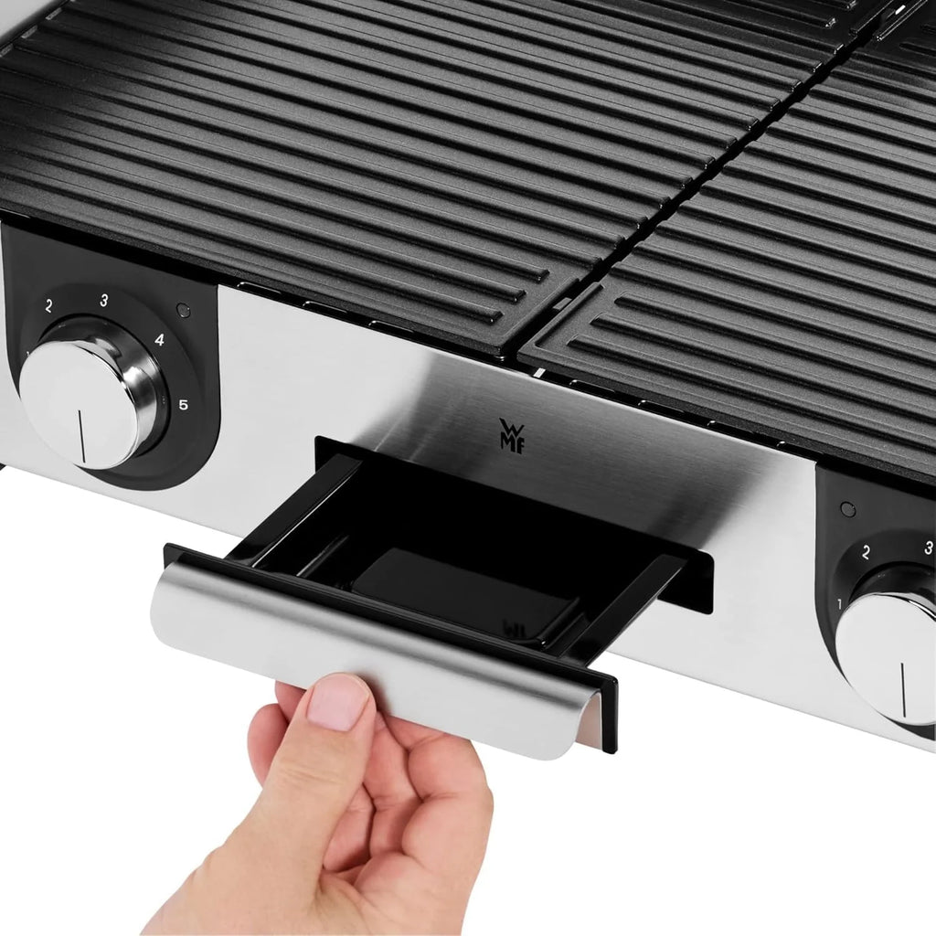 Parrilla eléctrica WMF Lono Master Grill 2026, 50x28 cm, parrilla de mesa eléctrica con paravientos y bandeja recogegrasa, certificada para uso exterior, 2 superficies de cocción ajustables independientemente, 2400 W, acero inoxidable mate.