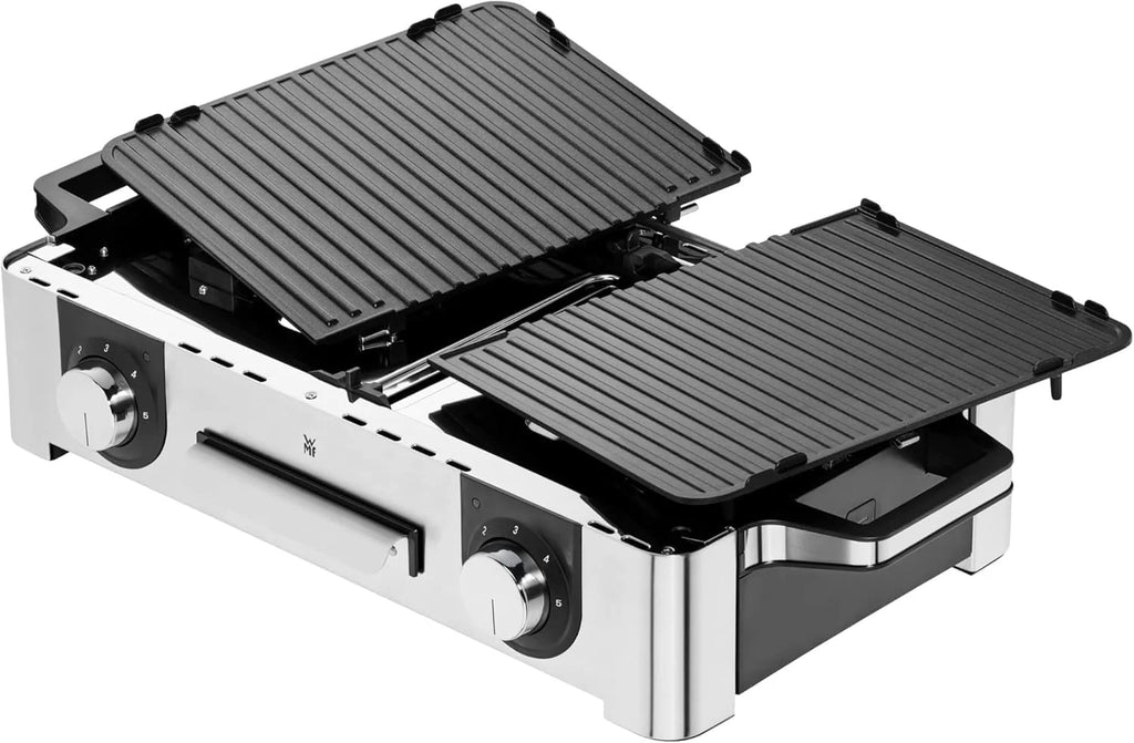 Parrilla eléctrica WMF Lono Master Grill 2026, 50x28 cm, parrilla de mesa eléctrica con paravientos y bandeja recogegrasa, certificada para uso exterior, 2 superficies de cocción ajustables independientemente, 2400 W, acero inoxidable mate.